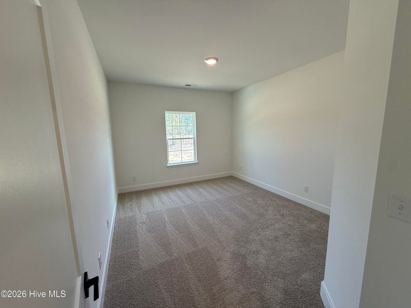 Spacious, unfurnished interior of a new home in Wood Creek Landing, Leland (Image 31).