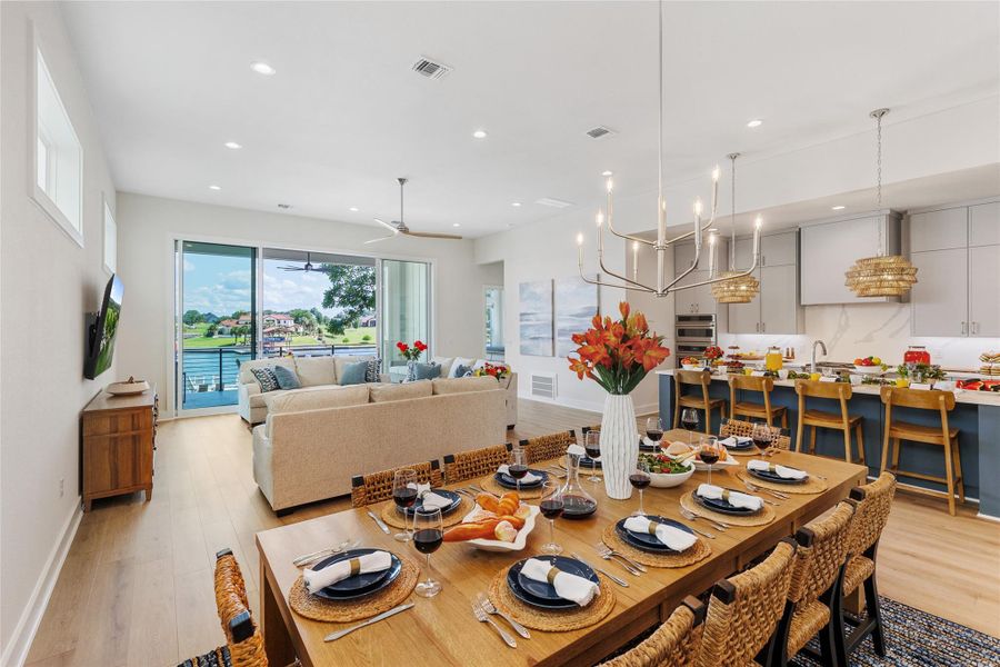 Dining area featuring recessed lighting, light wood finished floors, and ceiling fan Dining area featuring recessed lighting, light wood finished floors, and ceiling fan