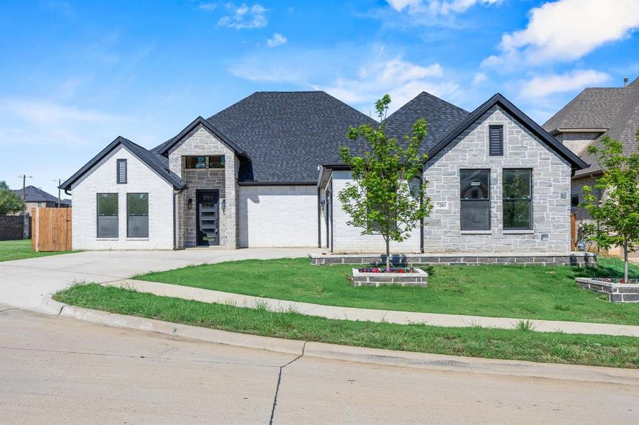 Modern architecture with a combination of light-colored brick and stone veneer Modern architecture with a combination of light-colored brick and stone veneer