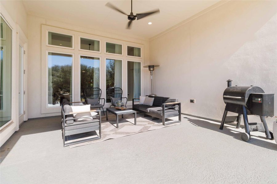Large covered patio with a ceiling fan, an outdoor hangout area Large covered patio with a ceiling fan, an outdoor hangout area