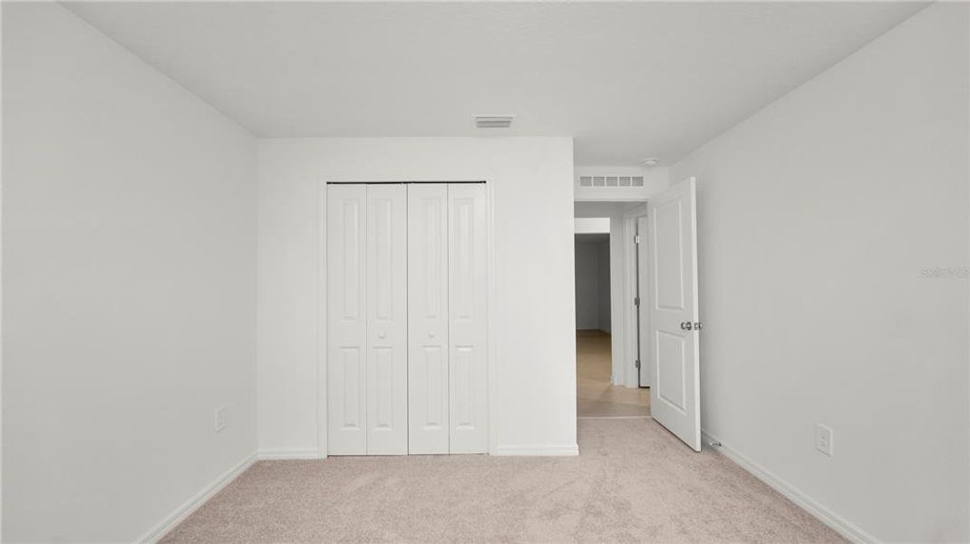 Spacious, unfurnished interior of a new home in Cypress Point at Lake Parker: The Estates, Lakeland (Image 38).