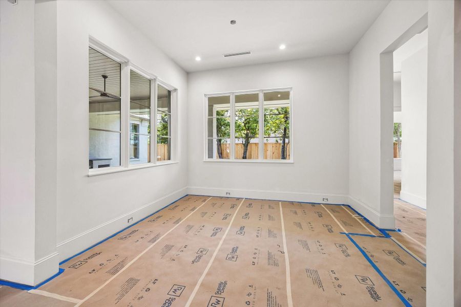 This light filled breakfast room is a great place to start your day! Ceiling light fixture to be installed.