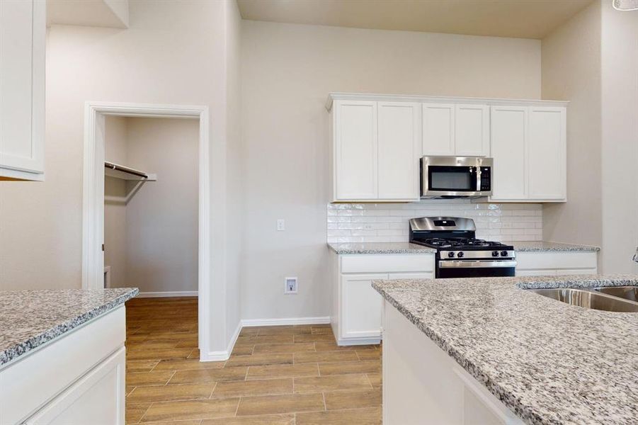 Furnished interior view inside a new home in Prairie Ridge at Goodland, Venus (Image 8).