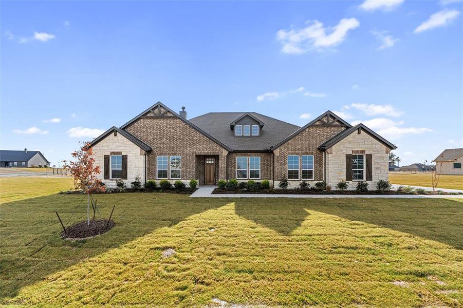 Front exterior of a new home in Eagle Ridge Estates, Weatherford, TX, highlighting curb appeal (Image 22).