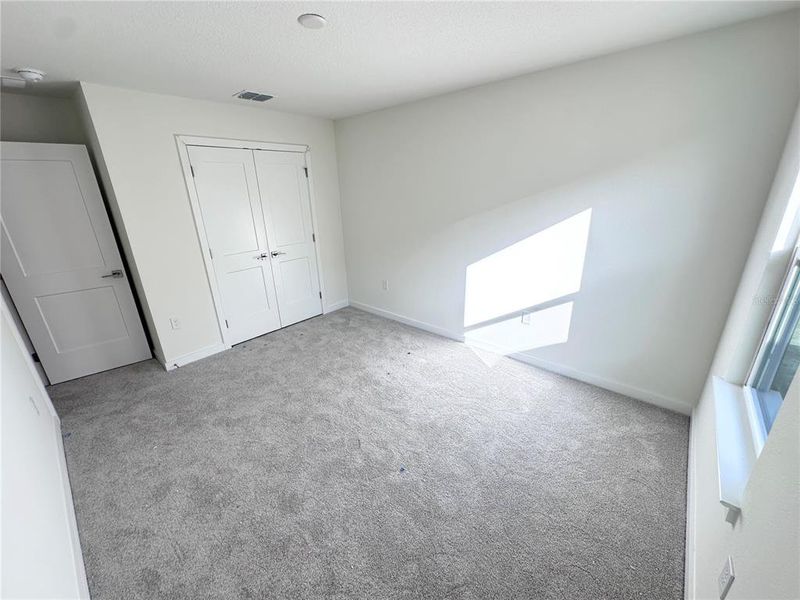 Spacious, unfurnished interior of a new home in Grasslands West, Lakeland (Image 26).