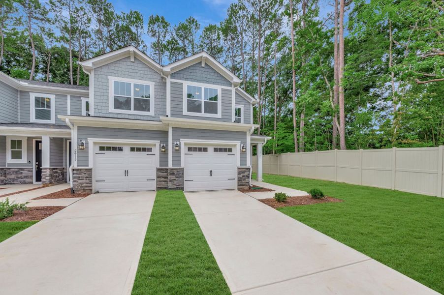Front exterior of a new home in Ashmore Townes, Garner, NC, highlighting curb appeal (Image 19). Front exterior of a new home in Ashmore Townes, Garner, NC, highlighting curb appeal (Image 19).