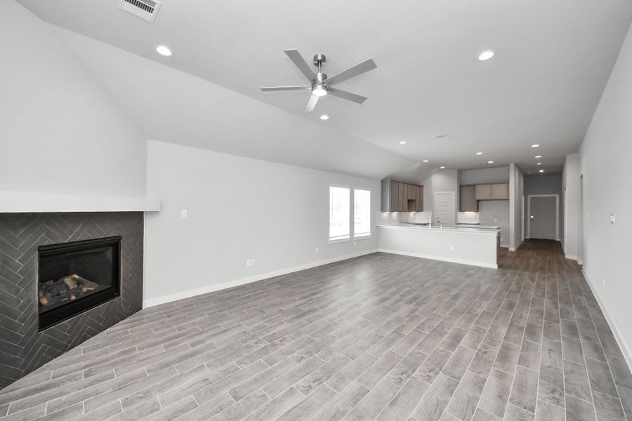 Relax and unwind in this inviting family room, illuminated by abundant natural light streaming in through tall windows, complemented by high ceilings and stunning flooring. Stay comfortable year-round with the gentle breeze from the ceiling fan, creating the perfect atmosphere for family gatherings. Relax and unwind in this inviting family room, illuminated by abundant natural light streaming in through tall windows, complemented by high ceilings and stunning flooring. Stay comfortable year-round with the gentle breeze from the ceiling fan, creating the perfect atmosphere for family gatherings.