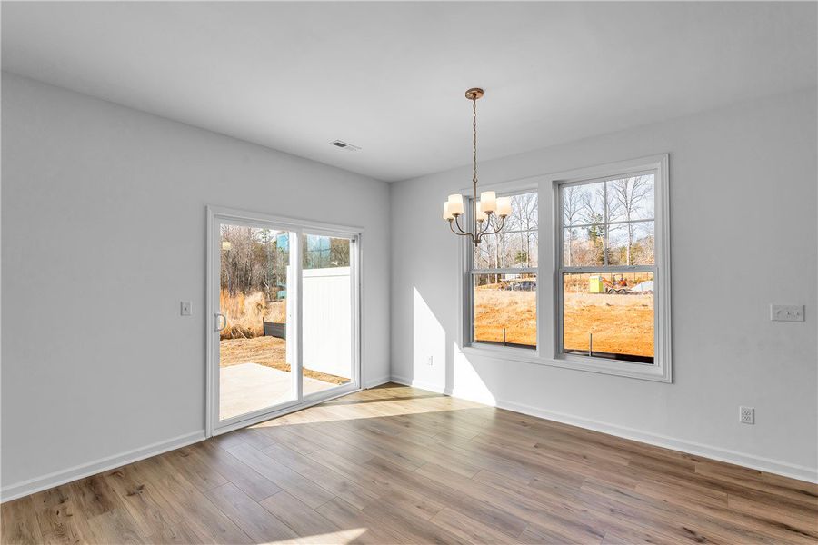 This bright interior space features wood flooring