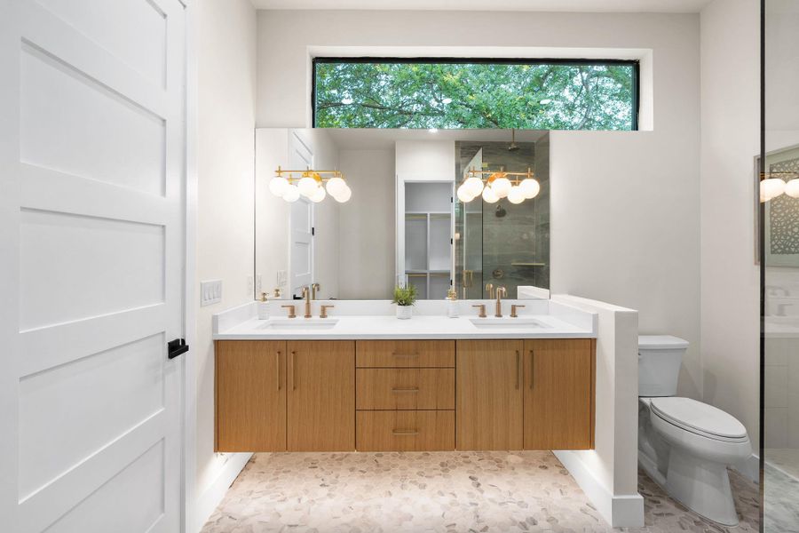 Floating wood-finish vanity with dual sinks and white countertops