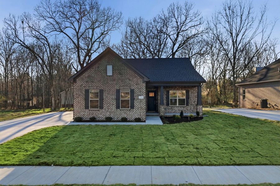 Front exterior of a new home in Sagewood, Tullahoma, TN, highlighting curb appeal (Image 6).