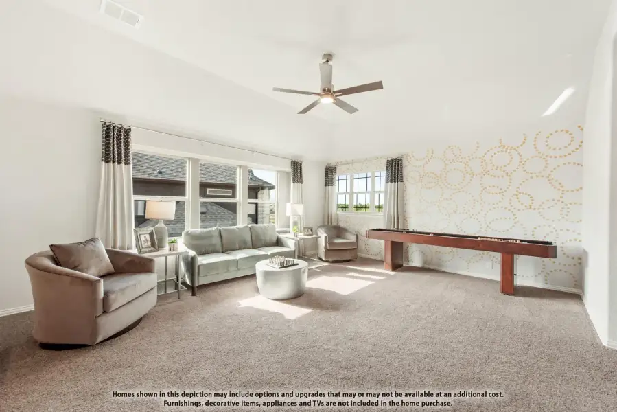 Bonus room with carpet, ceiling fan, seating area, and shuffleboard table along decorative accent wall