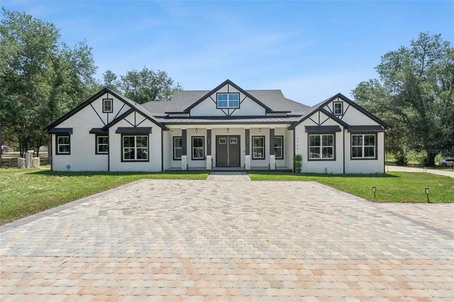 Front exterior of a new home in , Groveland, FL, highlighting curb appeal (Image 1). Front exterior of a new home in , Groveland, FL, highlighting curb appeal (Image 1).