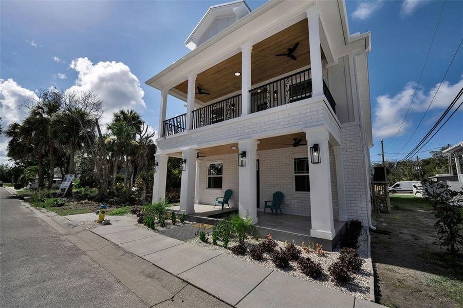 Front exterior of a new home in , Tarpon Springs, FL, highlighting curb appeal (Image 2). Front exterior of a new home in , Tarpon Springs, FL, highlighting curb appeal (Image 2).