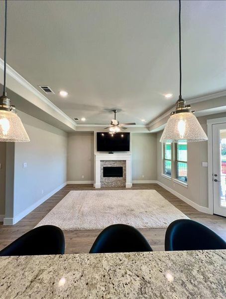 Open view from your kitchen island sink to the family room.