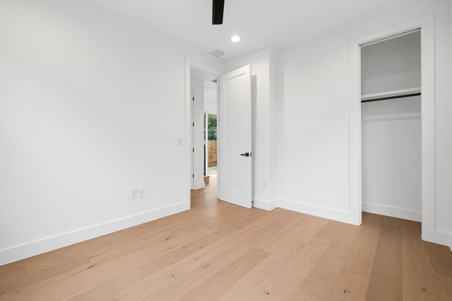 Unfurnished bedroom with light wood-type flooring, recessed lighting, a closet, and a ceiling fan Unfurnished bedroom with light wood-type flooring, recessed lighting, a closet, and a ceiling fan