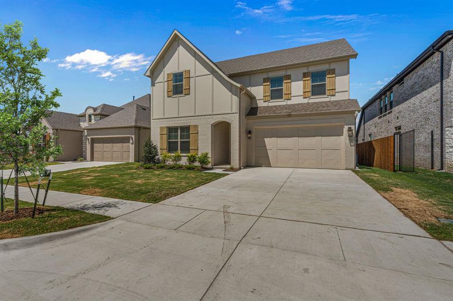 Front exterior of a new home in The Bluffs at Parks of Aledo, Aledo, TX, highlighting curb appeal (Image 19).