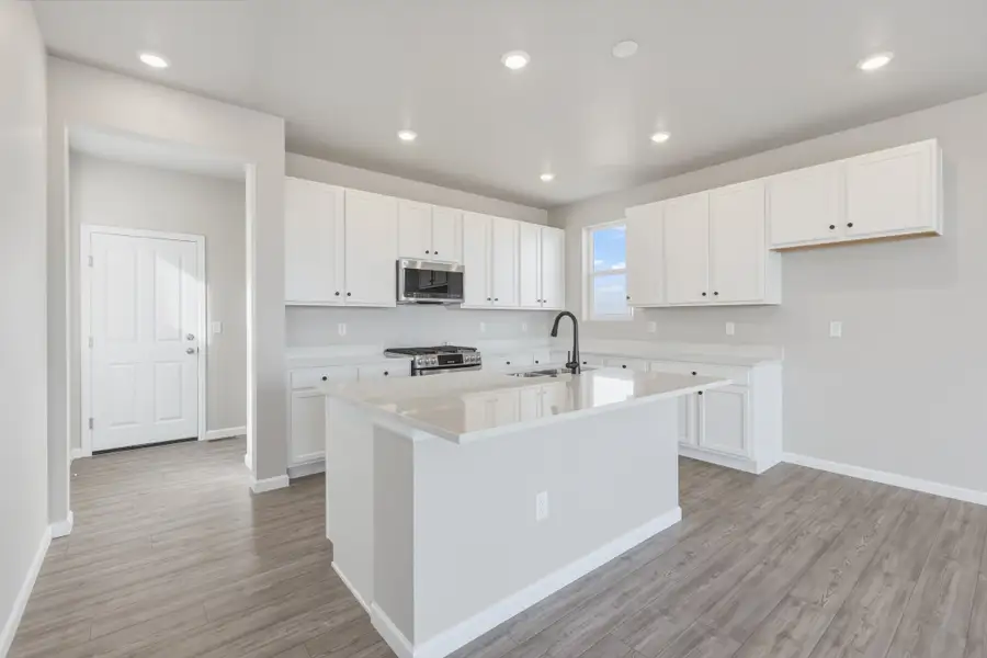 Furnished interior view inside a new home in The Aurora Highlands, Aurora (Image 6).