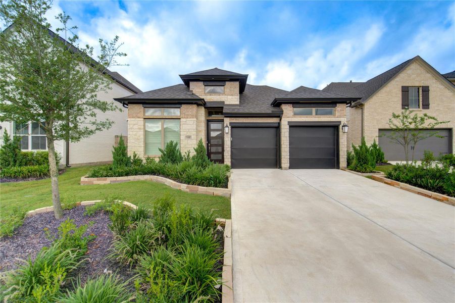 Front exterior of a new home in Cross Creek West, Fulshear, TX, highlighting curb appeal (Image 25).