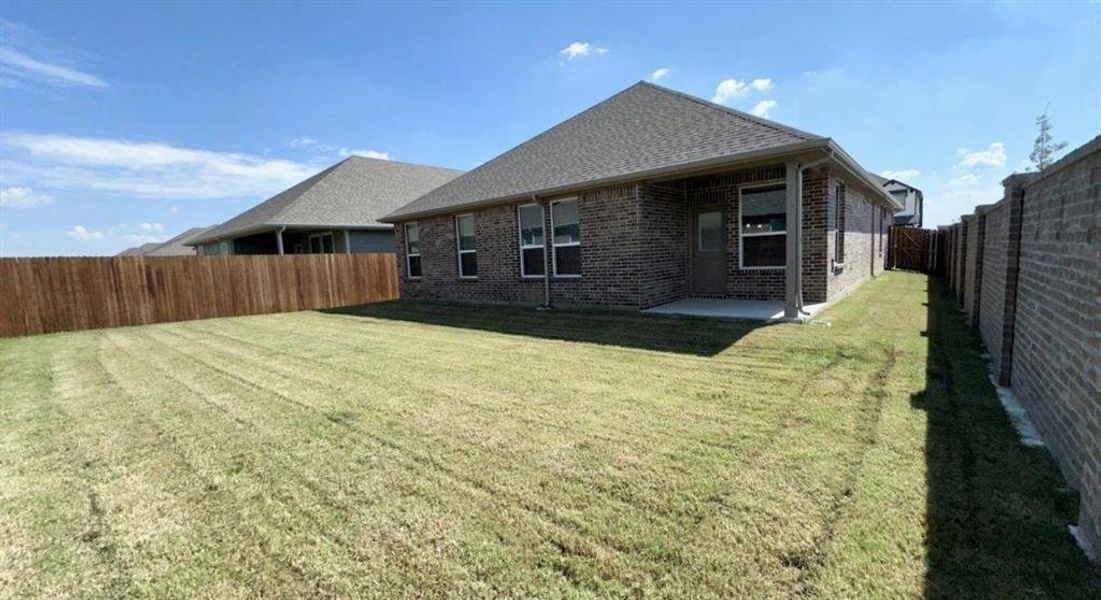 Exterior details and patio area of a home in Eagle Creek, Denton (Image 2). Exterior details and patio area of a home in Eagle Creek, Denton (Image 2).