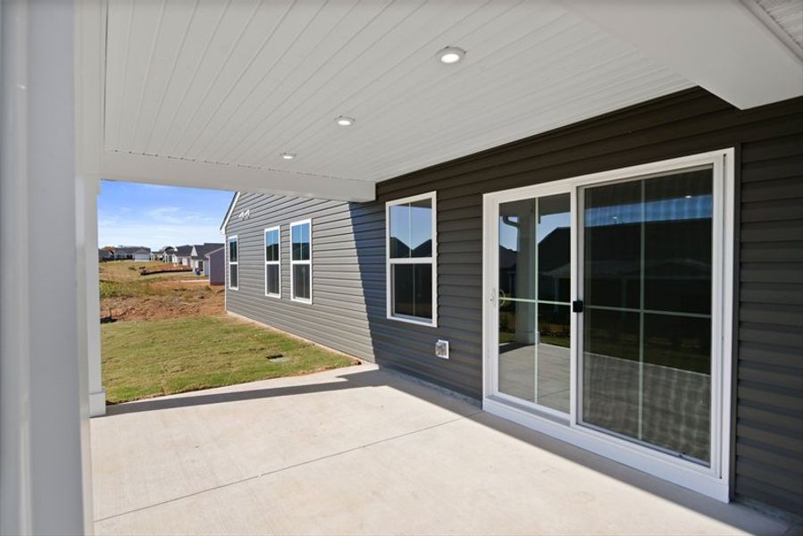 Exterior details and patio area of a home in Reidville Town Center Cottages, Duncan (Image 3).
