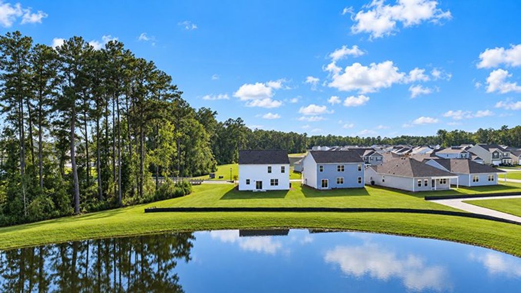 Front exterior of a new home in Pine Hills at Cane Bay, Summerville, SC, highlighting curb appeal (Image 2).