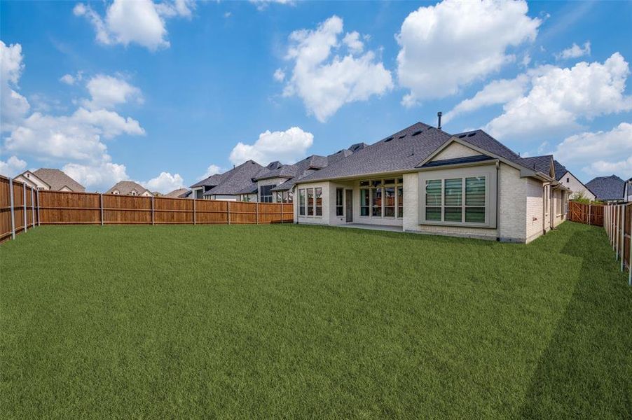 Enjoy endless possibilities in this oversized backyard, offering plenty of room to create the outdoor living space of your dreams. Situated on a desirable larger homesite, the fully fenced yard provides ample space for a future pool, outdoor kitchen, play area, or garden while still leaving room to entertain. The covered patio is perfect for relaxing with your morning coffee or hosting gatherings, making this backyard an ideal extension of the home's living space. Enjoy endless possibilities in this oversized backyard, offering plenty of room to create the outdoor living space of your dreams. Situated on a desirable larger homesite, the fully fenced yard provides ample space for a future pool, outdoor kitchen, play area, or garden while still leaving room to entertain. The covered patio is perfect for relaxing with your morning coffee or hosting gatherings, making this backyard an ideal extension of the home's living space.