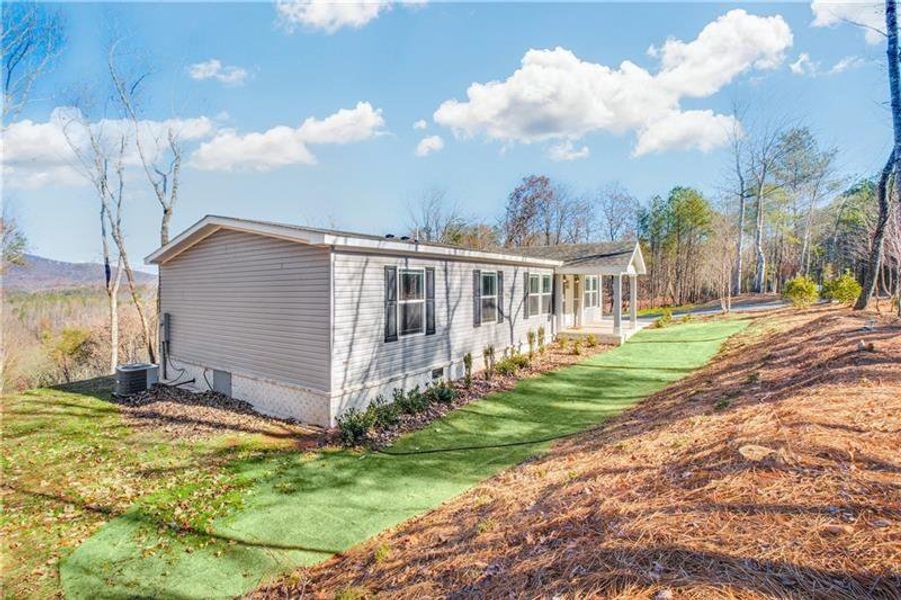 Front exterior of a new home in , Ball Ground, GA, highlighting curb appeal (Image 20).