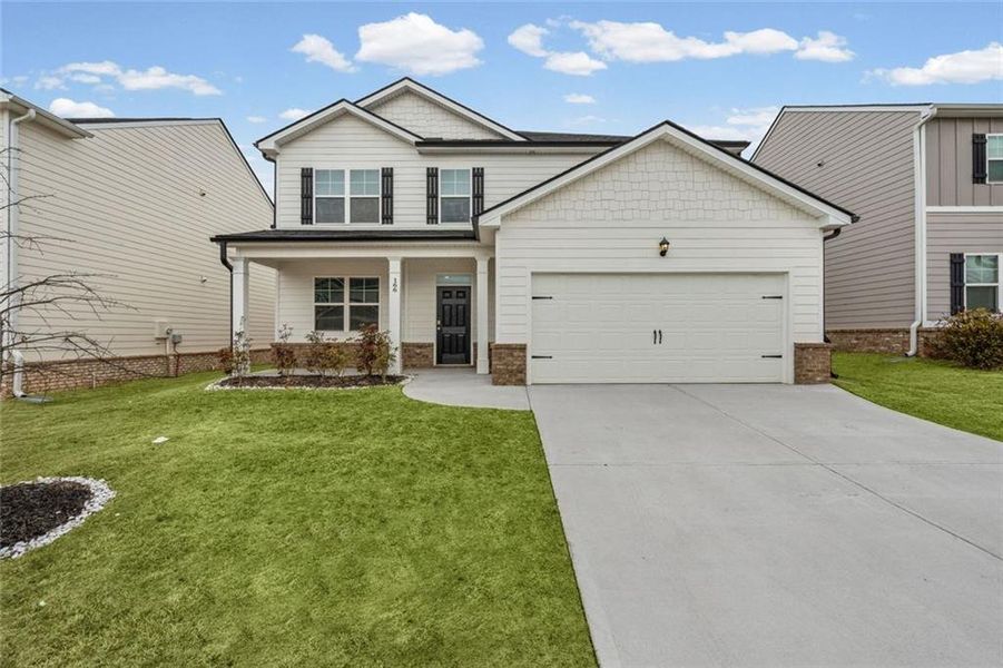 Front exterior of a new home in Twin Lakes, Hoschton, GA, highlighting curb appeal (Image 25).