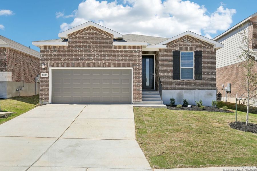 Front exterior of a new home in Comanche Ridge, San Antonio, TX, highlighting curb appeal (Image 20). Front exterior of a new home in Comanche Ridge, San Antonio, TX, highlighting curb appeal (Image 20).