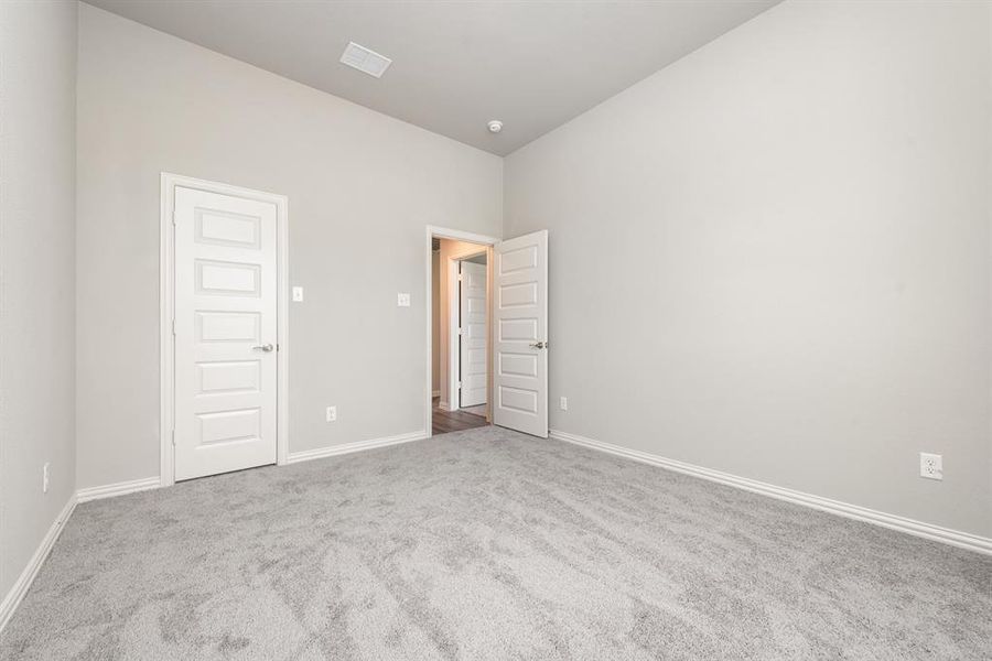 Unfurnished bedroom featuring carpet flooring