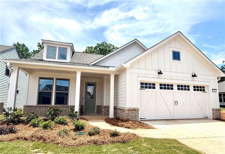 Front exterior of a new home in Del Webb Chateau Elan, Hoschton, GA, highlighting curb appeal (Image 1). Front exterior of a new home in Del Webb Chateau Elan, Hoschton, GA, highlighting curb appeal (Image 1).