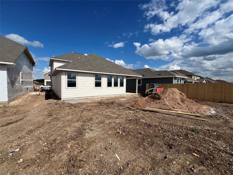 Front exterior of a new home in Rolling Glen, Hutto, TX, highlighting curb appeal (Image 12).