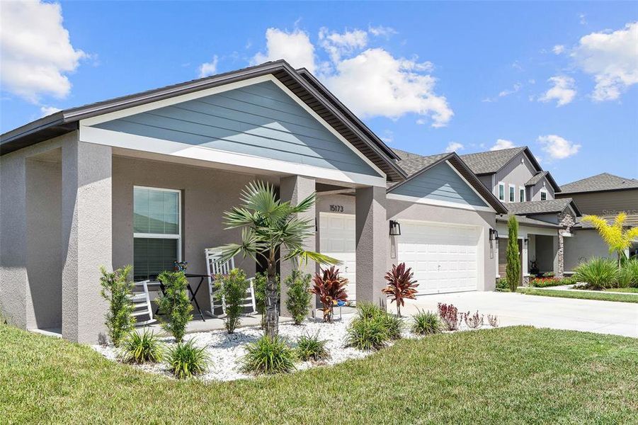 Front exterior of a new home in Balm Grove, Wimauma, FL, highlighting curb appeal (Image 25).