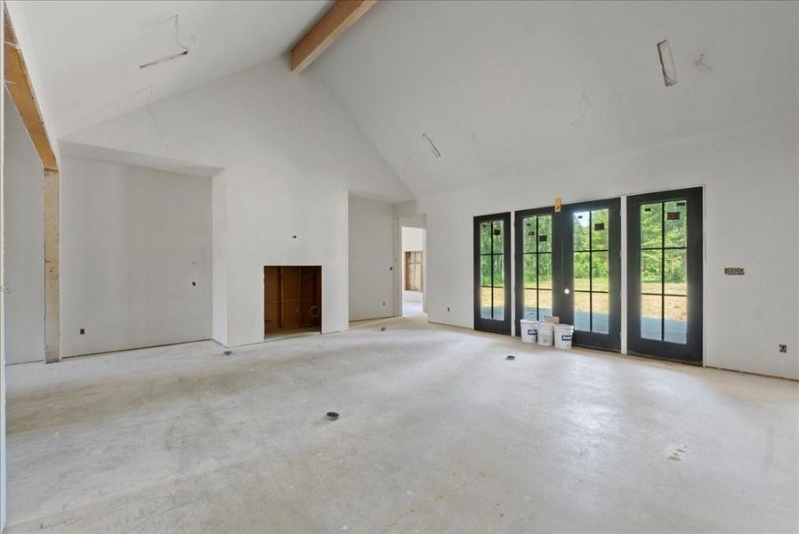 Great room. Door leads into primary bedroom. Great room. Door leads into primary bedroom.