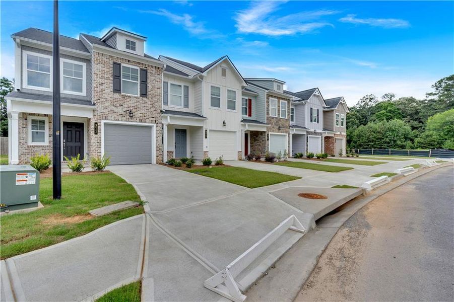 Exterior details and patio area of a home in Village Green, Adairsville (Image 29).