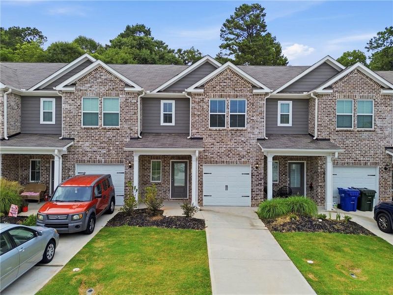 Front exterior of a new home in , Oakwood, GA, highlighting curb appeal (Image 1). Front exterior of a new home in , Oakwood, GA, highlighting curb appeal (Image 1).
