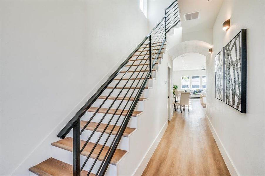 Stairs featuring wood-type flooring