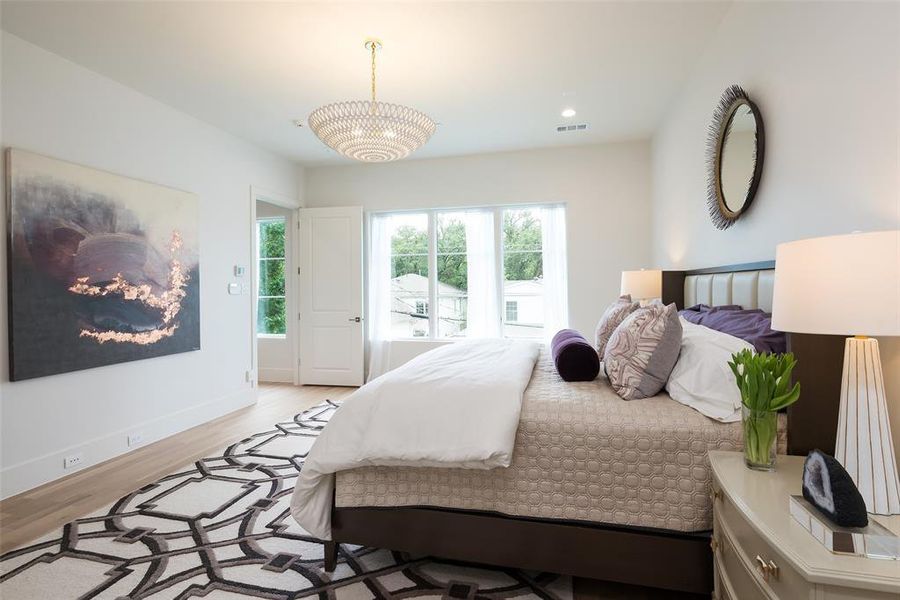 Bedroom with light hardwood / wood-style floors