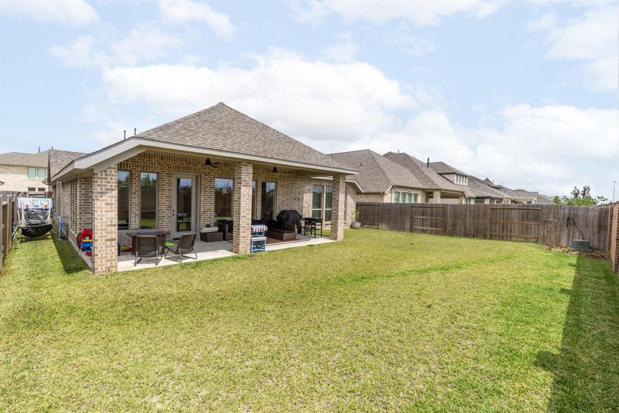Exterior details and patio area of a home in Marvida, Cypress (Image 21).