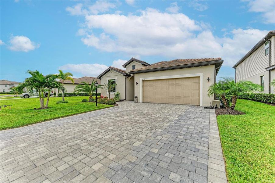 Front exterior of a new home in , Lakewood Ranch, FL, highlighting curb appeal (Image 27). Front exterior of a new home in , Lakewood Ranch, FL, highlighting curb appeal (Image 27).