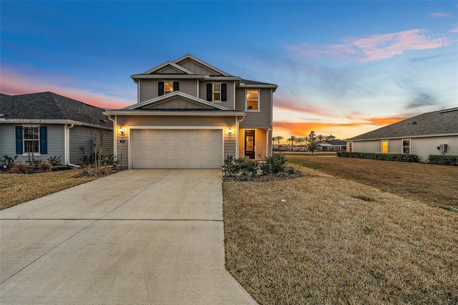 Front exterior of a new home in Somerset - Classic Series, Palm Coast, FL, highlighting curb appeal (Image 24).