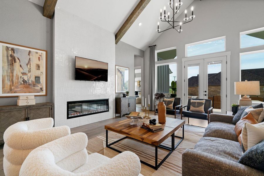 A striking fireplace feature wall anchors this grand living room. A striking fireplace feature wall anchors this grand living room.