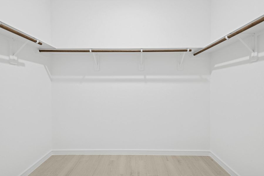 Primary walk-in closet (*Photo not of actual home and used for illustration purposes only.)