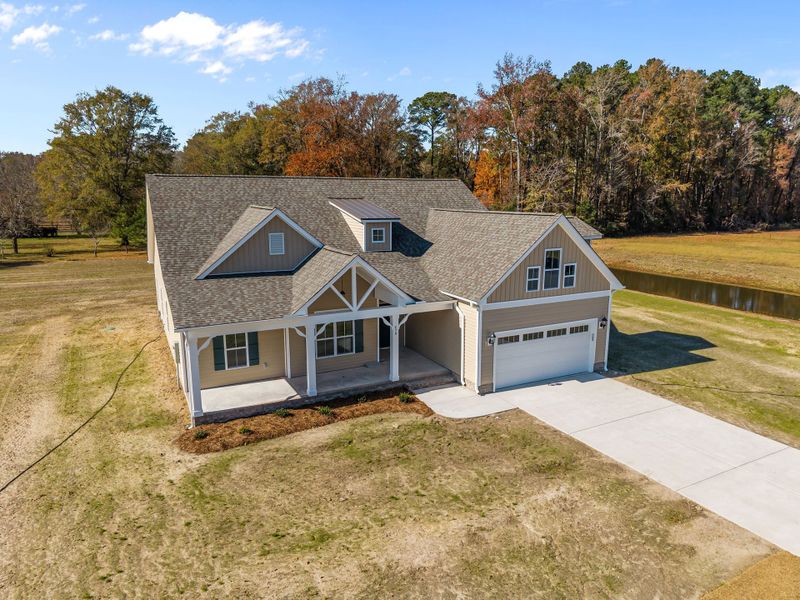 Front exterior of a new home in Kennedy's Crossing, Grimesland, NC, highlighting curb appeal (Image 22).