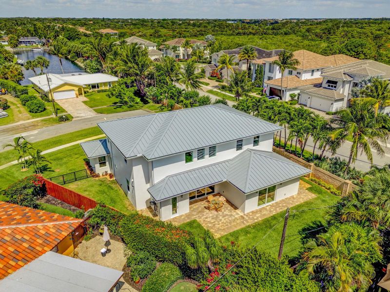Front exterior of a new home in , North Palm Beach, FL, highlighting curb appeal (Image 28). Front exterior of a new home in , North Palm Beach, FL, highlighting curb appeal (Image 28).