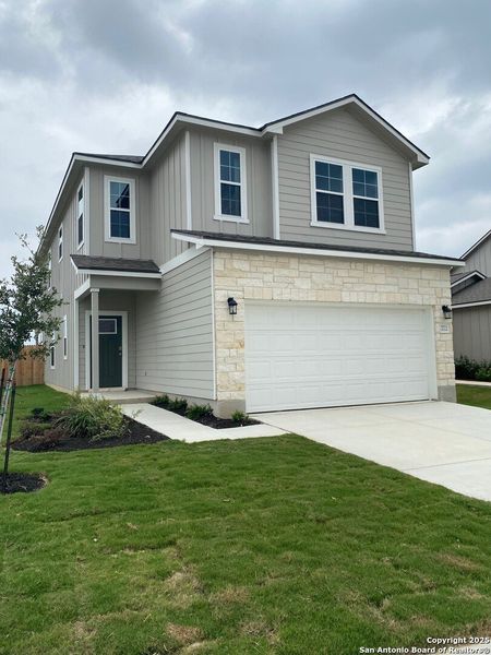 Front exterior of a new home in Highland Ridge, New Braunfels, TX, highlighting curb appeal (Image 1). Front exterior of a new home in Highland Ridge, New Braunfels, TX, highlighting curb appeal (Image 1).