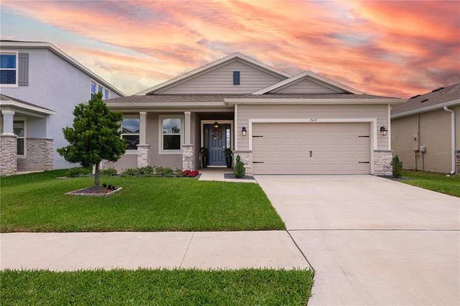 Front exterior of a new home in Farm at Varrea, Plant City, FL, highlighting curb appeal (Image 25).