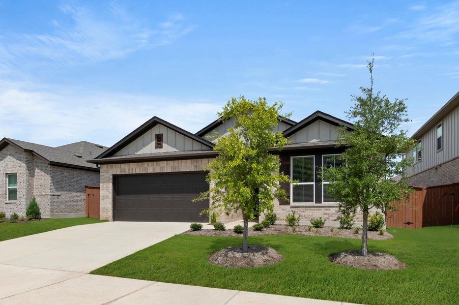 Front exterior of a new home in Oaks at San Gabriel, Georgetown, TX, highlighting curb appeal (Image 21).