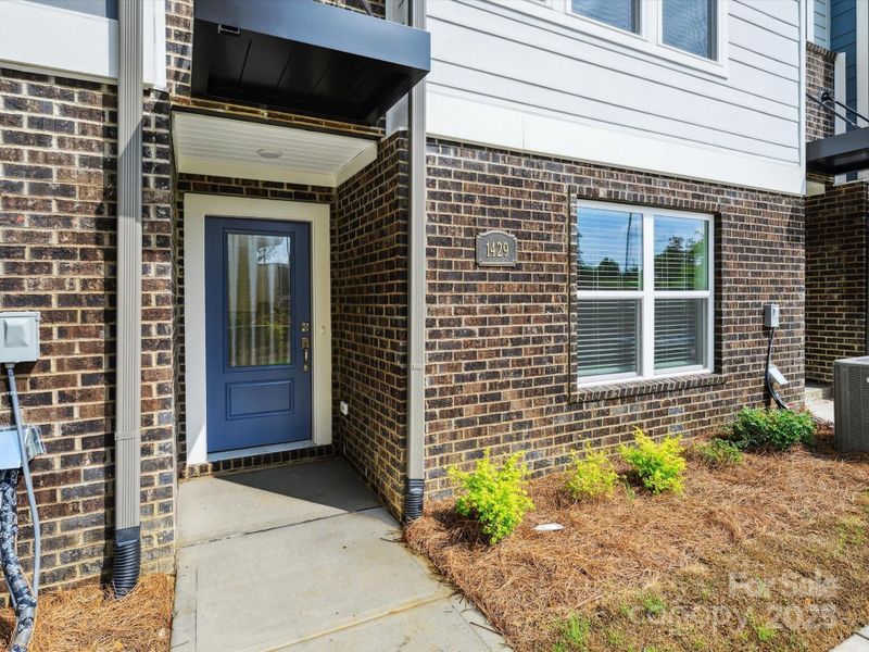 Front exterior of a new home in Central Living at Craig, Charlotte, NC, highlighting curb appeal (Image 17).