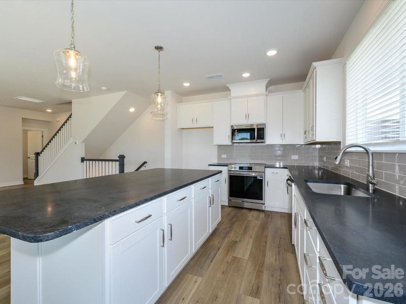 Furnished interior view inside a new home in Central Living at Craig, Charlotte (Image 5).